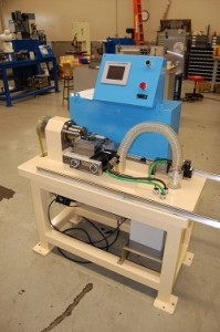 Bench style CNC cutoff machine in production