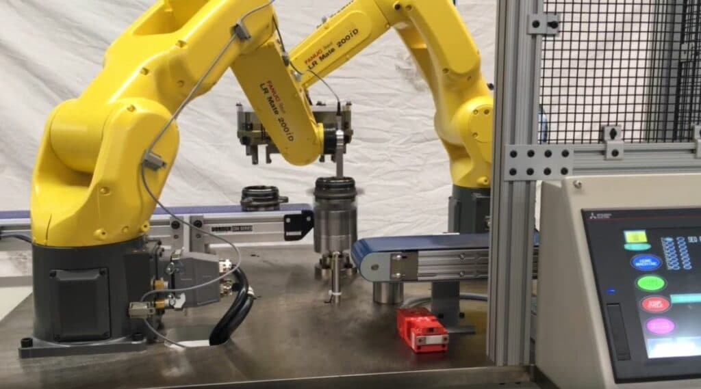 automotive bearing inspection machine with automated robots and eddy current probes